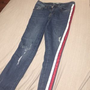 Blue ripped jeans with lines